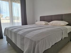 Postel nebo postele na pokoji v ubytování Apartment Mara