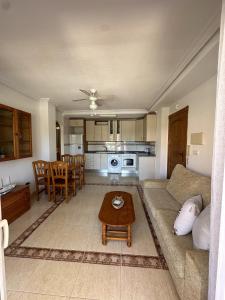 a living room with a couch and a table at Ipanema 52 - La Manga By WATERMELON in La Manga del Mar Menor