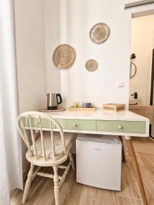 a desk and a chair in a room at Family Room in Nice