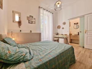 a bedroom with a bed and a desk at Family Room in Nice