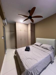 a bedroom with a bed with a ceiling fan at AS Homestay Gamuda Gardens Gaia Residence 2R1B Rawang Skyline Luge in Rawang +13 photos