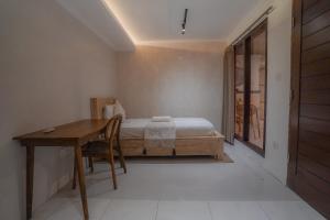 Postel nebo postele na pokoji v ubytování Made Arsa Homestay