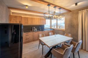 Kuchyň nebo kuchyňský kout v ubytování Filzsteinresort Wohnungen Top 1 + 7 fotografií