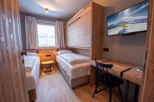 Postel nebo postele na pokoji v ubytování Filzsteinresort Wohnungen Top 1