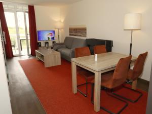 TV a/nebo společenská místnost v ubytování Resort Deichgraf Resort Deichgraf 31-12