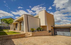 a large white house with a driveway at Casa do Douro& Porto in Lousada