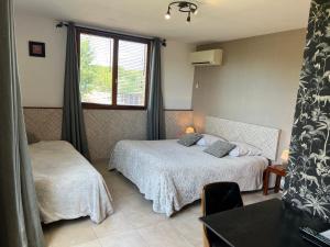 Postel nebo postele na pokoji v ubytování GuestHouse Le Patio34