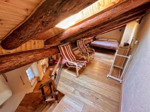Postel nebo postele na pokoji v ubytování Le Village de Bruil