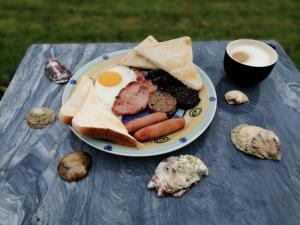 a plate of breakfast food on a table at Puffin rooms in Lisdoonvarna