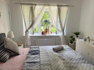 Ένα ή περισσότερα κρεβάτια σε δωμάτιο στο Room In Appartment