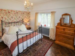 En eller flere senge i et værelse på The Manor House Skerry Vore