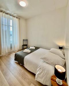 Posteľ alebo postele v izbe v ubytovaní Appartement T2 Place Carnot -DABNB