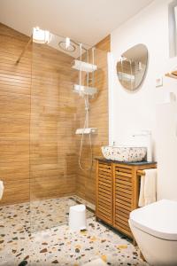 a bathroom with a shower and a toilet and a sink at Summerhouse Blanka 2024 in Vir
