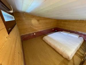 Postel nebo postele na pokoji v ubytování La tiny house de Chaparon + 7 fotografií