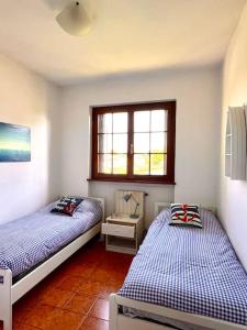 Ένα ή περισσότερα κρεβάτια σε δωμάτιο στο Villetta in Versilia