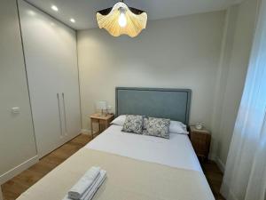 En eller flere senge i et værelse på Como en casa