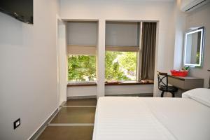 Postel nebo postele na pokoji v ubytování Hotel Vila Emes