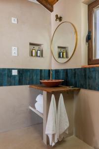 a bathroom with a sink and a mirror at Casa da Bolota T1 - Monte do Serrado de Baixo in Évora