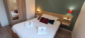 Łóżko lub łóżka w pokoju w obiekcie Auva - SILS Maison 48 m2 à 5 minutes à pied de la plage