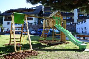two childrens playground equipment in a park at Activehotel Diana in Siusi