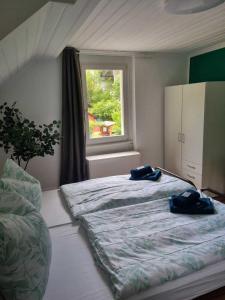 Voodi või voodid majutusasutuse Hotel - Haus Biasca toas