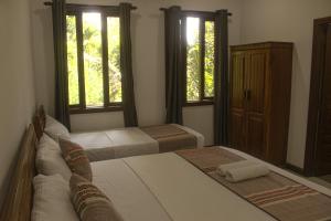 Postel nebo postele na pokoji v ubytování Sierra Mount Villa