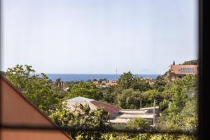a view of a city from a window at Casa vacanze da Nicola in Saponara Villafranca