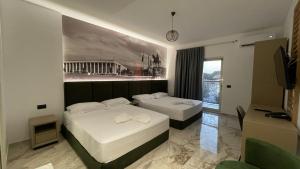 Postel nebo postele na pokoji v ubytování Hotel Ruko Boutique