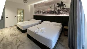 Postel nebo postele na pokoji v ubytování Hotel Ruko Boutique