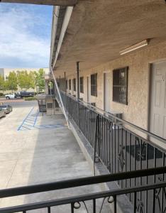 an outside view of a building with a balcony at Hi Rise Motel in Lynwood