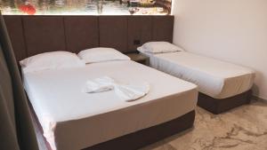 Postel nebo postele na pokoji v ubytování Hotel Ruko Boutique
