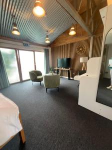 a room with two beds and a tv in it at Jackie's Place in Wexford