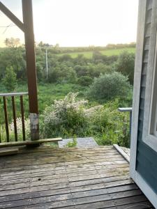 a porch with a view of a field at Executive one bedroom apartment including pull out sofa bed in Antigonish