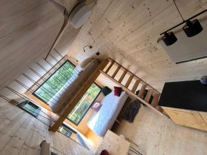 an overhead view of a bedroom in a tiny house at Moose Home Tiny house Genêts in Cros