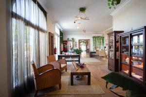 a living room with chairs and a table at Hotel Albaida Nature in Mazagón