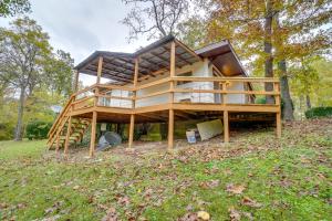 a house is being built in a field at Table Rock Lake Cabin with Deck and Bar! in Shell Knob