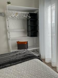 a bedroom with a bed and a closet at Old Dream in Nazaré +4 photos