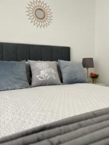 a bedroom with a bed with a black head board at Old Dream in Nazaré