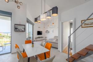 Μια τηλεόραση ή/και κέντρο ψυχαγωγίας στο Apartment Seaside & Golf