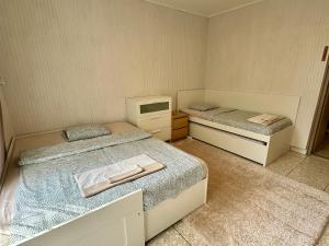 Posteľ alebo postele v izbe v ubytovaní Pálkövei 65. Apartman