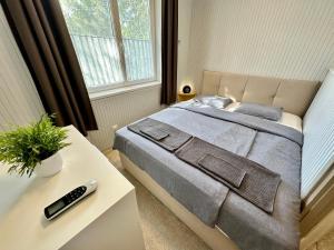 Posteľ alebo postele v izbe v ubytovaní Pálkövei 65. Apartman