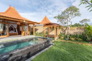 an image of a villa with a swimming pool at The Patra Villa Sebatu by Dhananjaya Hospitality in Tampaksiring