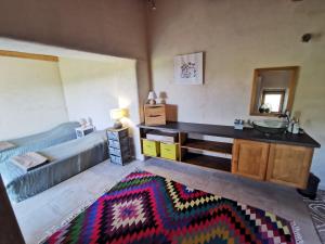 a bathroom with a sink and a counter in a room at Les IRIS des Rieux in Sallelles