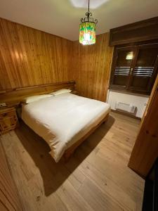 Ένα ή περισσότερα κρεβάτια σε δωμάτιο στο Appartamento Larsech