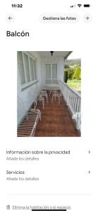 a screenshot of a balcony with chairs in a building at Pensión montoxo in Cedeira