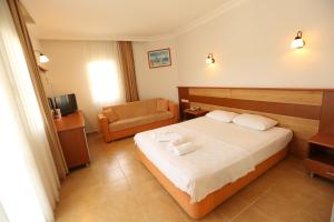 Postel nebo postele na pokoji v ubytování Mavruka Hotel + 37 fotografií
