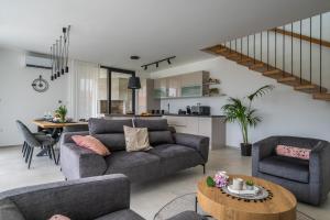 a living room with a couch and a table at Villa Celi whit heating pool Fazana Pula in Fažana