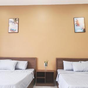 Postel nebo postele na pokoji v ubytování Nhà nghỉ Rico