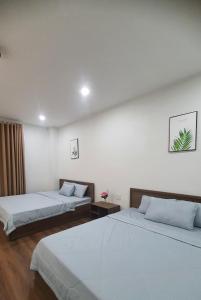 Postel nebo postele na pokoji v ubytování Nhà nghỉ Rico + 6 fotografií