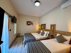 Кровать или кровати в номере Bodrum Konağı
